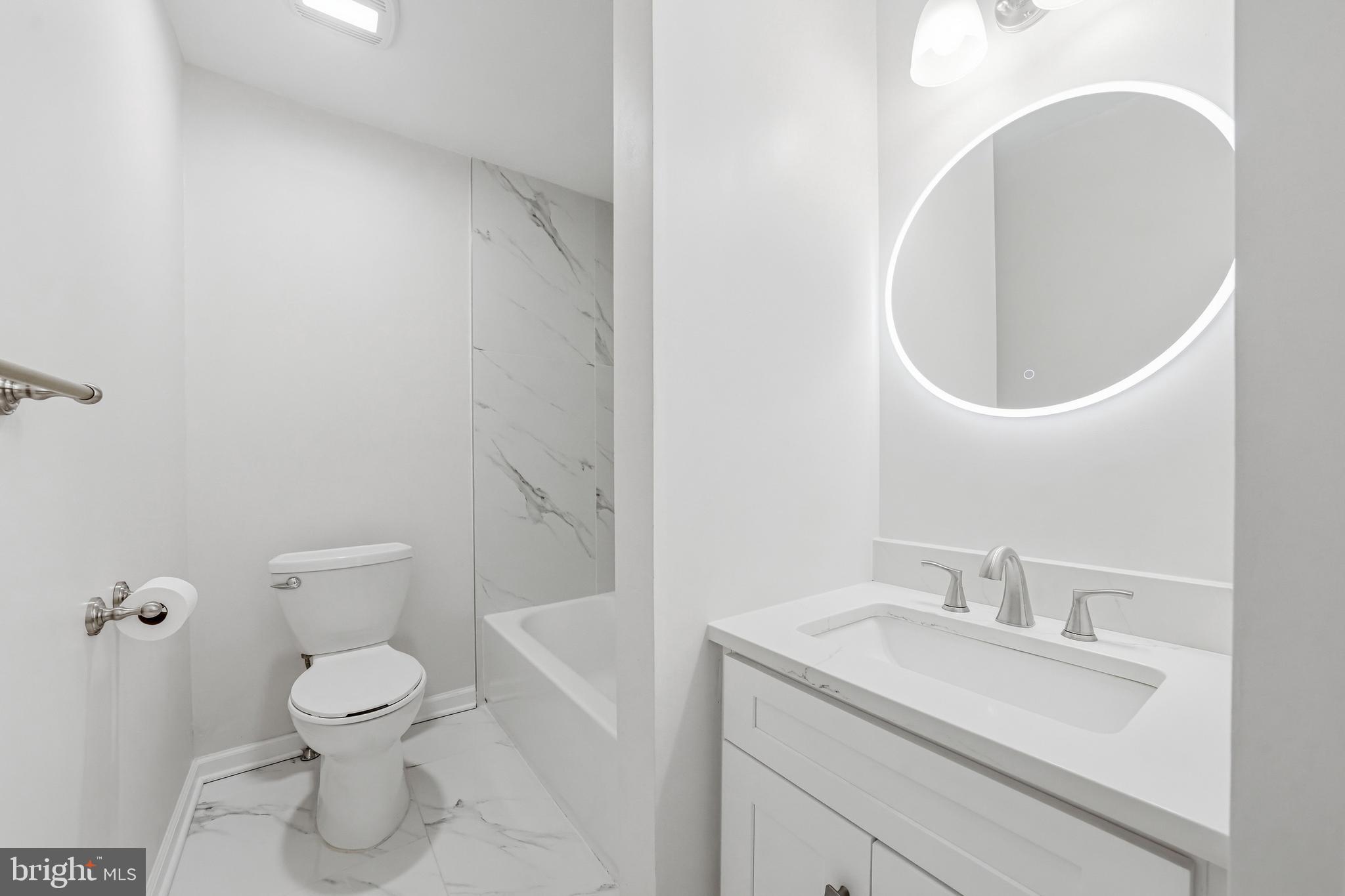 635 East Main Street, Unit 7 Moorestown, NJ 08057 - Photo 28 of 52 a bathroom with a toilet a sink and mirror