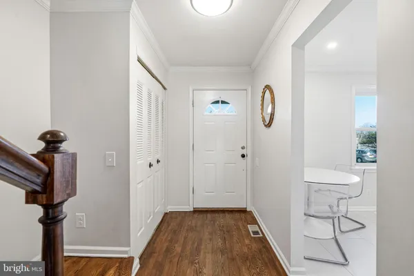 a view of entryway with wooden floor