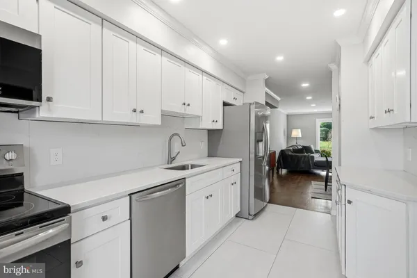 a kitchen with cabinets and a sink
