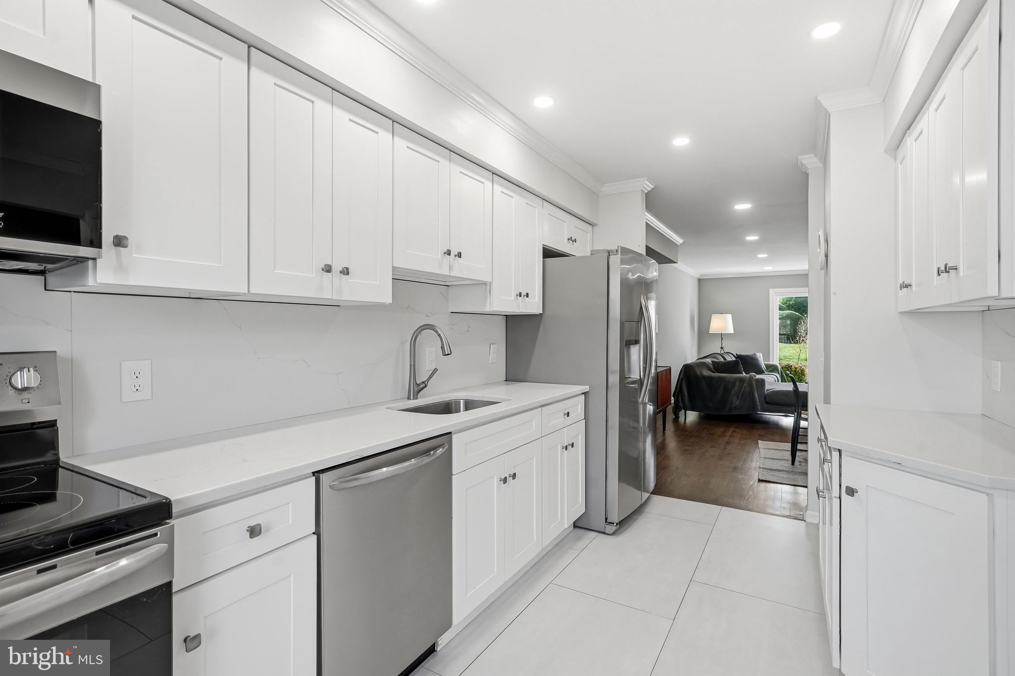635 East Main Street, Unit 7 Moorestown, NJ 08057 - Photo 7 of 52 a kitchen with sink cabinets and appliances