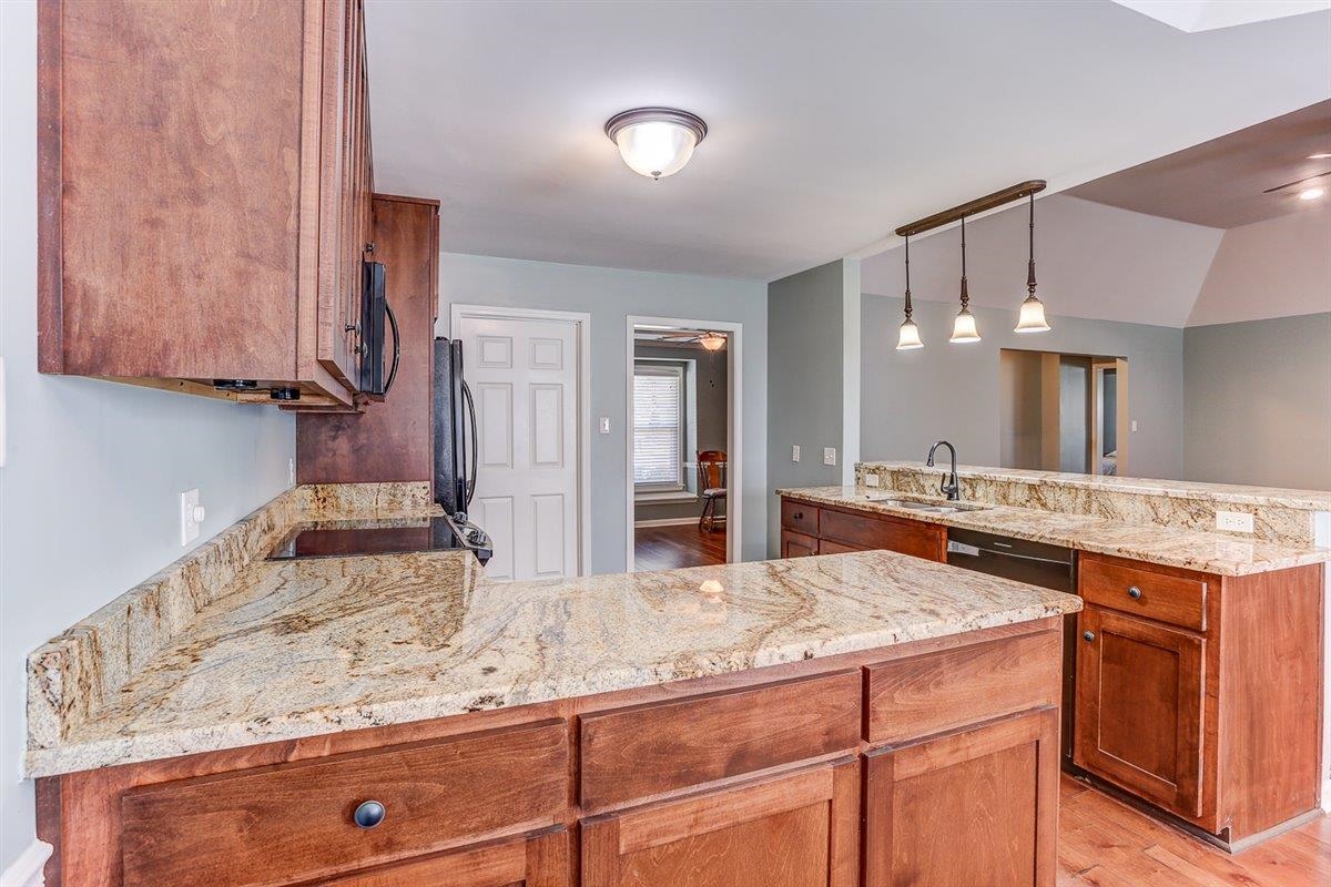 665 Lancelot Lane Collierville, TN 38017 - Photo 12 of 26 a kitchen with a sink and cabinets