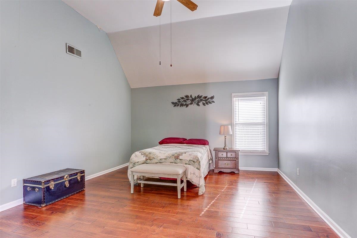 665 Lancelot Lane Collierville, TN 38017 - Photo 19 of 26 a living room with furniture and a wooden floor