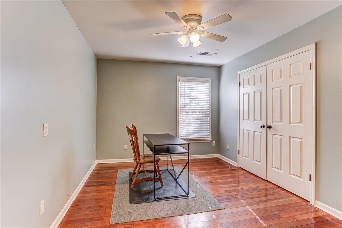 665 Lancelot Lane Collierville, TN 38017 - Photo 20 of 26 a dining room with wooden floor and a window
