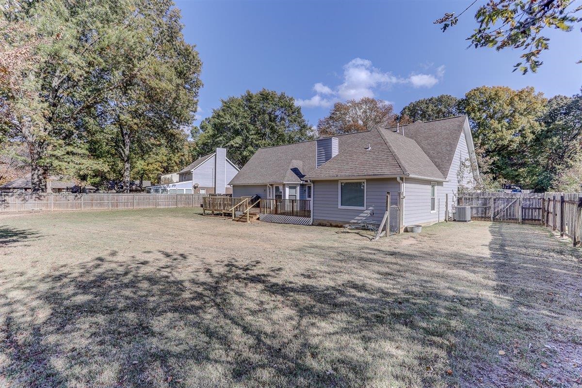 665 Lancelot Lane Collierville, TN 38017 - Photo 26 of 26 a front view of a house with a garden and a tree