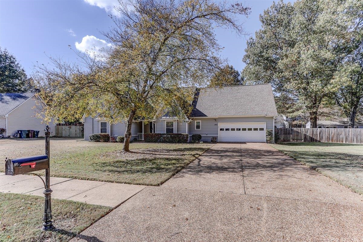 665 Lancelot Lane Collierville, TN 38017 - Photo 3 of 26 a view of a house with a yard and tree s