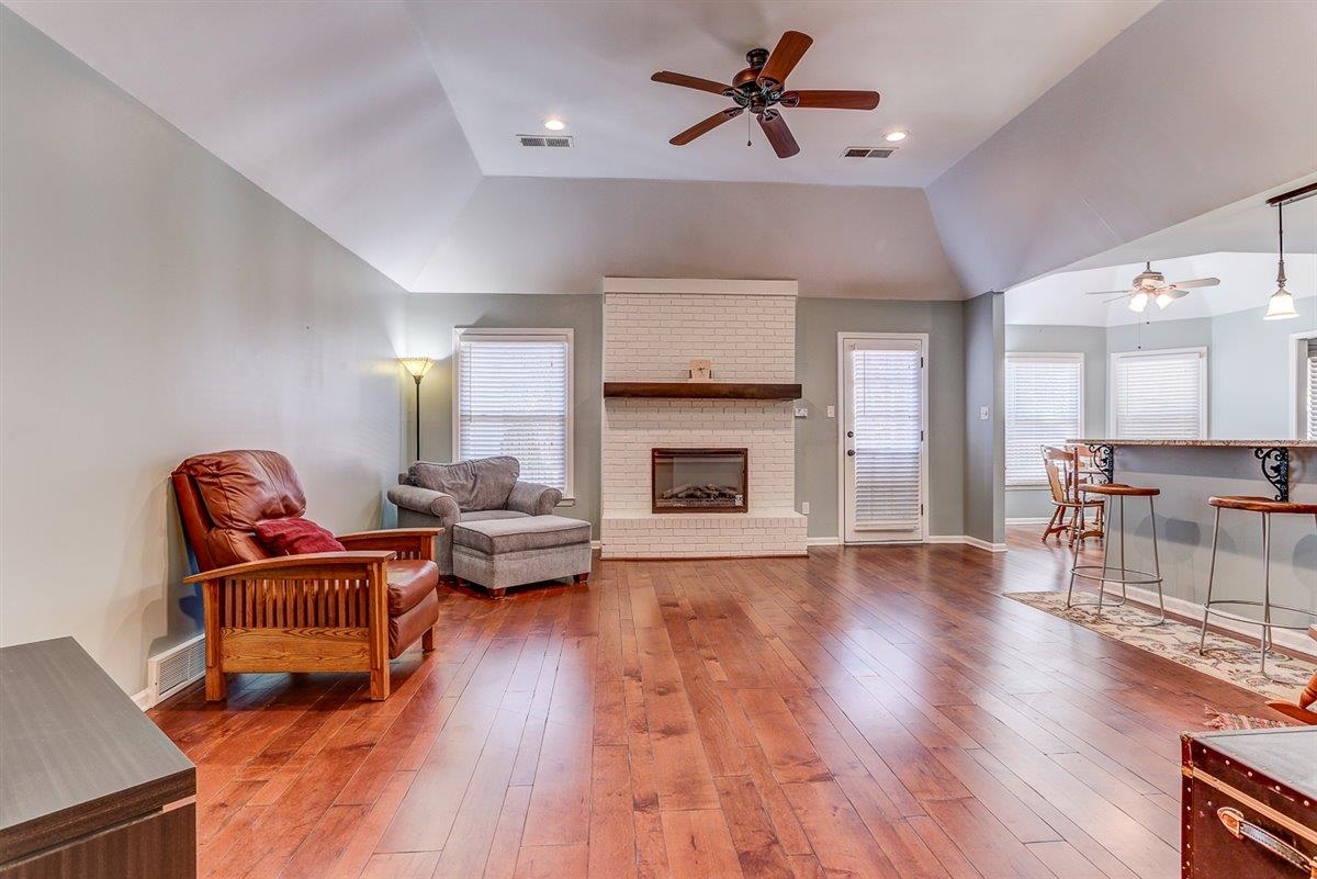 665 Lancelot Lane Collierville, TN 38017 - Photo 6 of 26 a living room with furniture and a fireplace