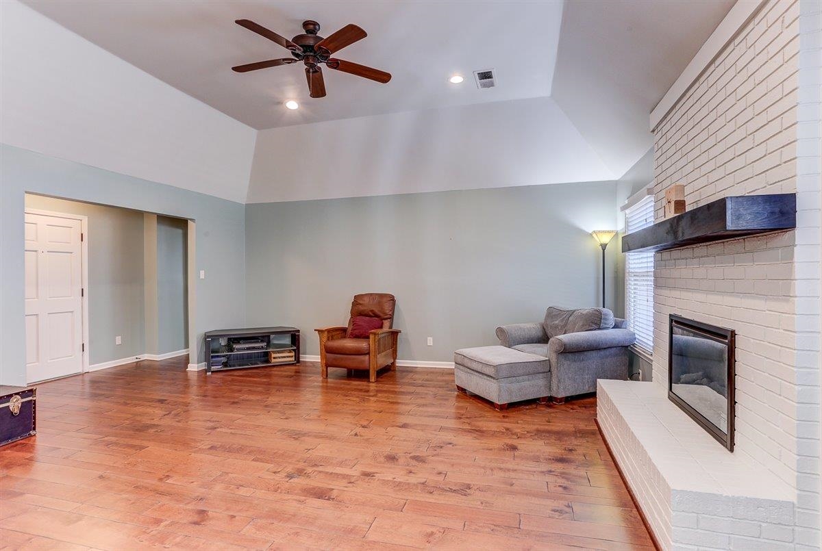 665 Lancelot Lane Collierville, TN 38017 - Photo 7 of 26 a living room with furniture and a fireplace