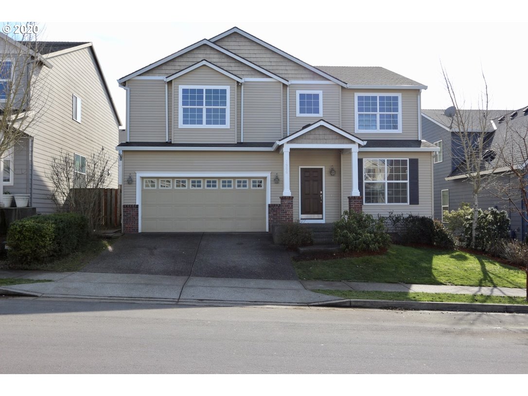 1986 Southwest 33rd Street Gresham, OR 97080 - Photo 1 of 32 a front view of a house with a yard