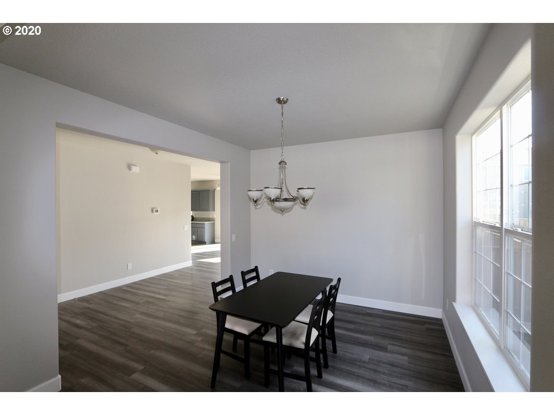 1986 Southwest 33rd Street Gresham, OR 97080 - Photo 11 of 32 a view of a dining room with furniture window and wooden floor