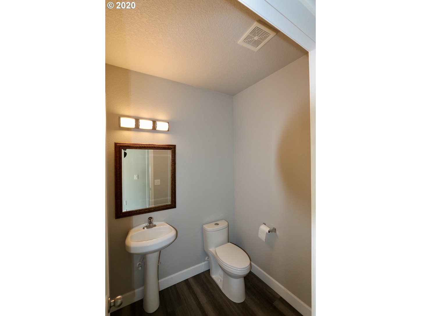 1986 Southwest 33rd Street Gresham, OR 97080 - Photo 18 of 32 a bathroom with a toilet sink and mirror