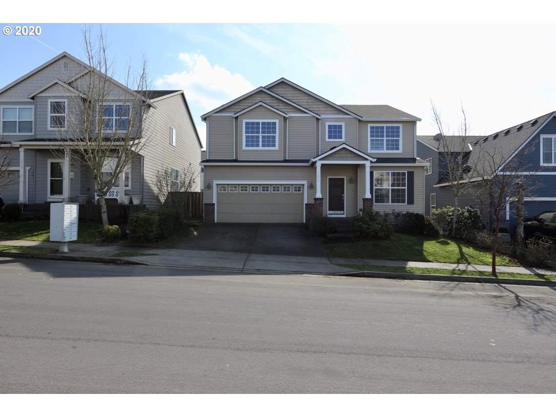 1986 Southwest 33rd Street Gresham, OR 97080 - Photo 2 of 32 a front view of a house with a garden