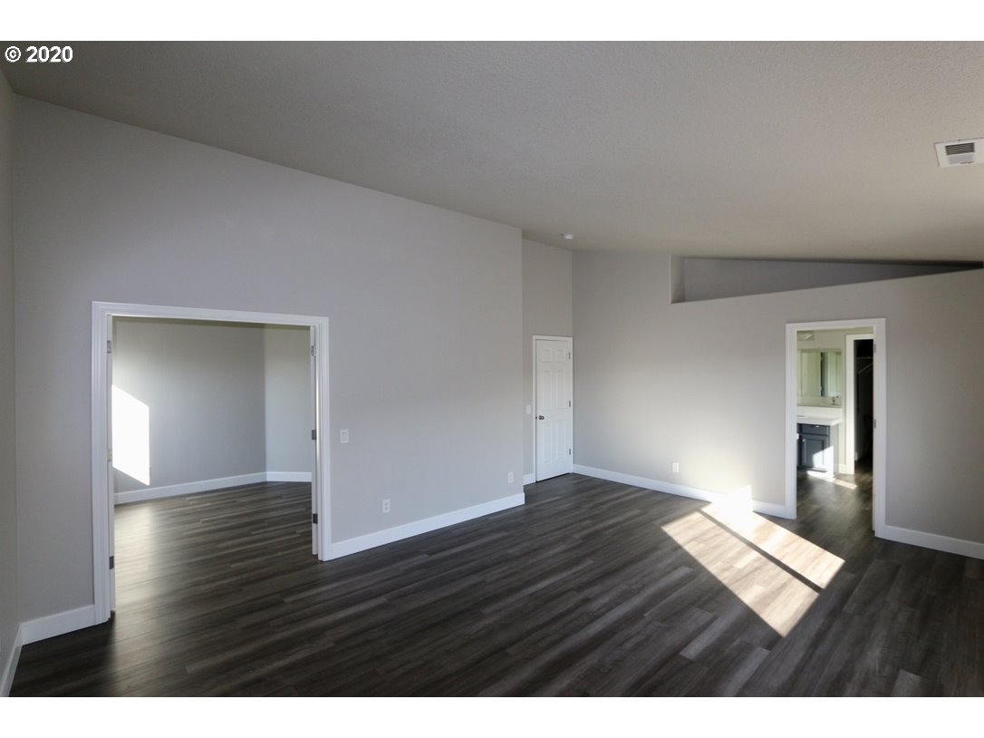 1986 Southwest 33rd Street Gresham, OR 97080 - Photo 21 of 32 a view of an empty room and wooden floor