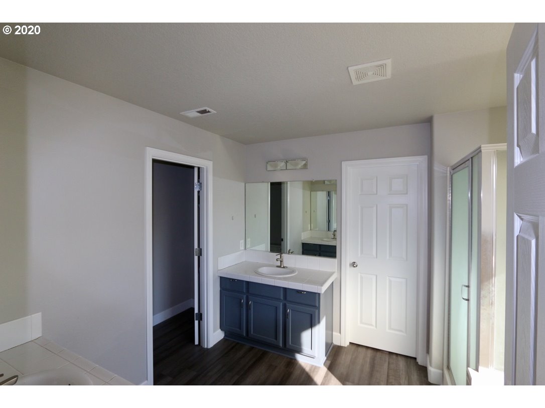 1986 Southwest 33rd Street Gresham, OR 97080 - Photo 25 of 32 a bathroom with a sink and a mirror