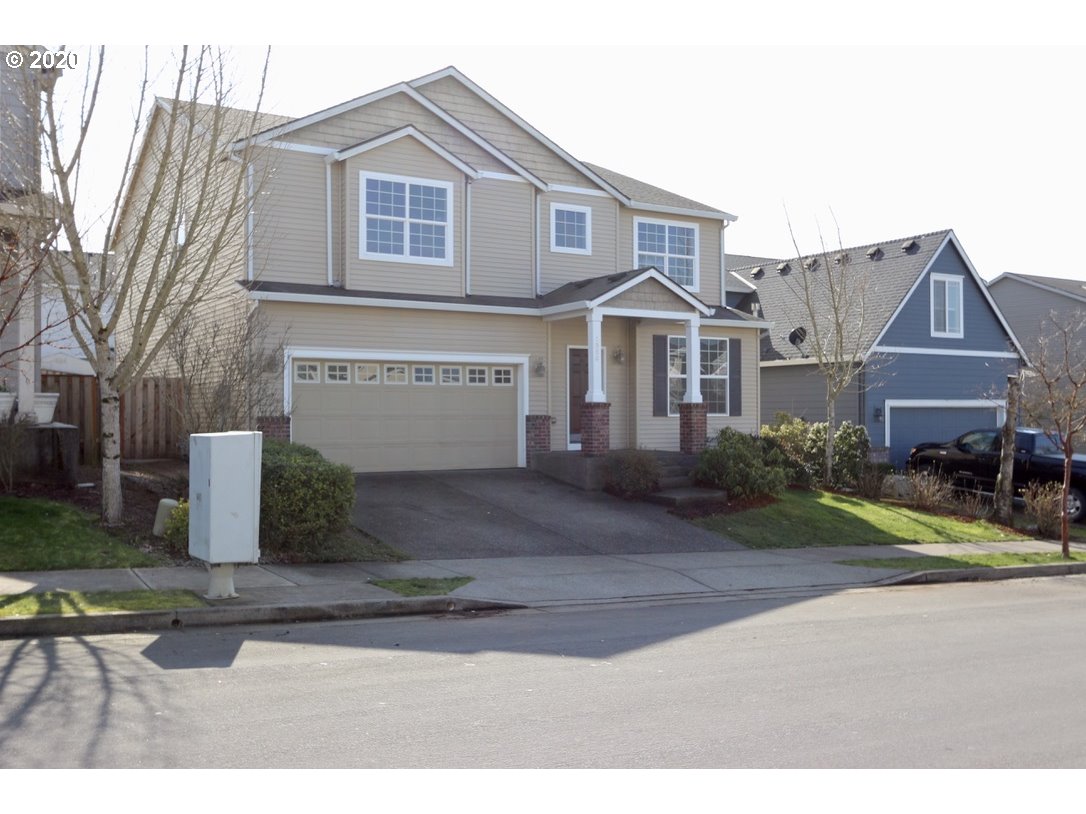 1986 Southwest 33rd Street Gresham, OR 97080 - Photo 3 of 32 a front view of a house with garden