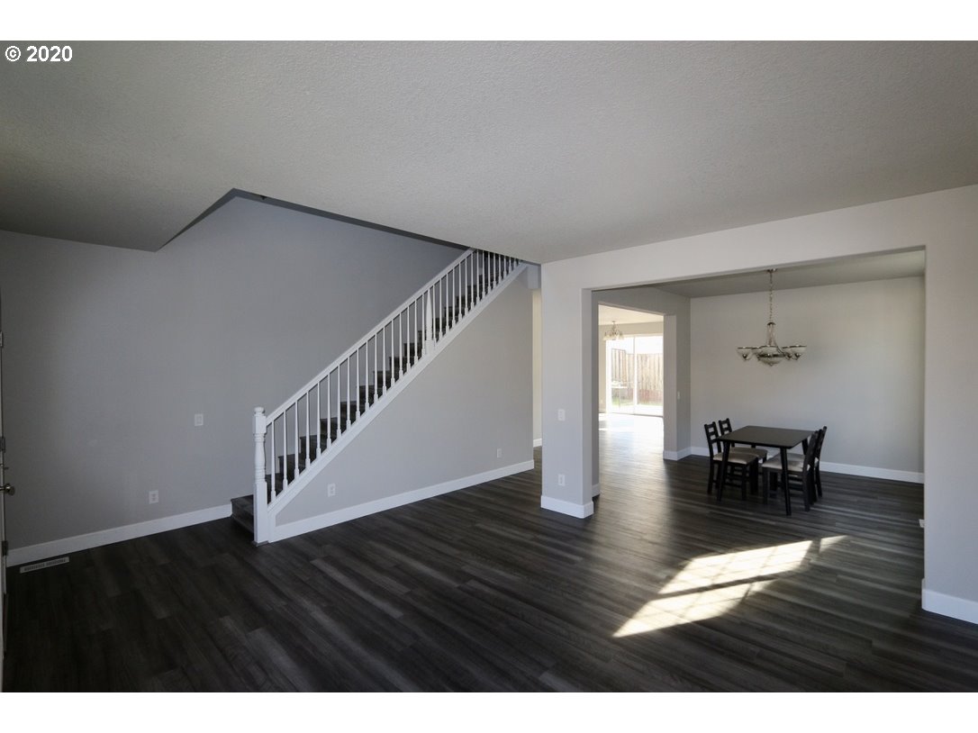 1986 Southwest 33rd Street Gresham, OR 97080 - Photo 10 of 32 a view of dining room and hall with wooden floor