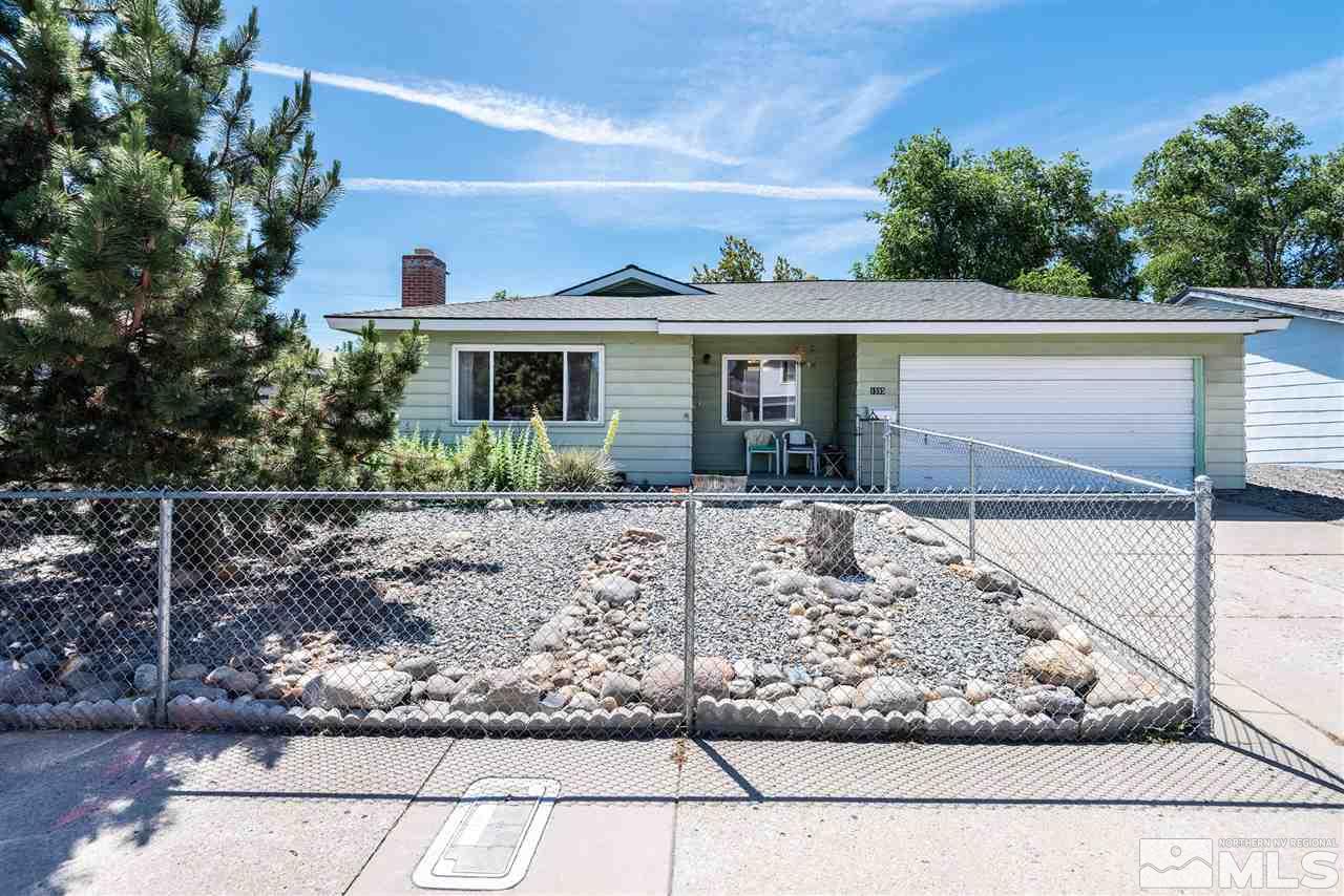 1555 Auburn Way Reno, NV 89502 - Photo 1 of 14 a front view of a house with garden