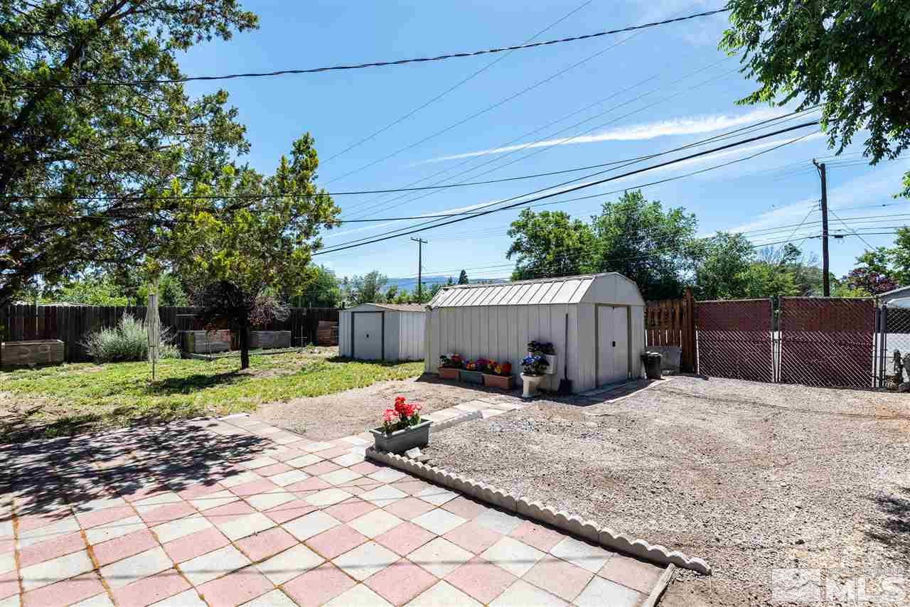 1555 Auburn Way Reno, NV 89502 - Photo 11 of 14 a backyard of a house with seating space and trees