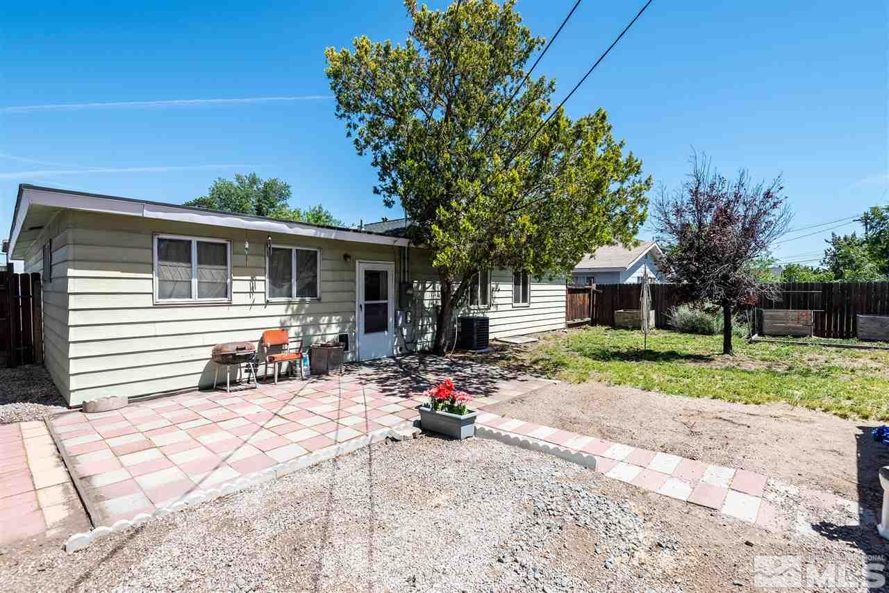 1555 Auburn Way Reno, NV 89502 - Photo 12 of 14 a view of a house with backyard and trees
