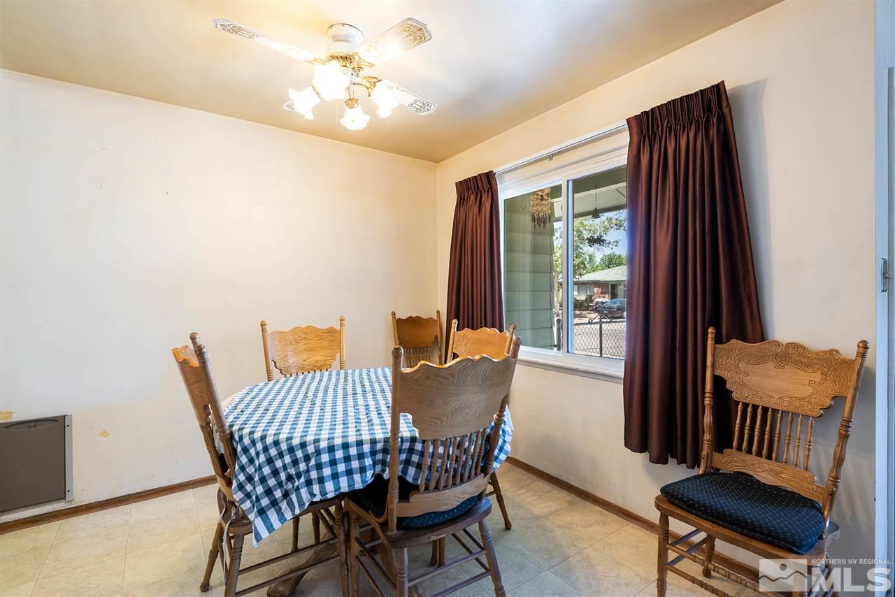 1555 Auburn Way Reno, NV 89502 - Photo 4 of 14 a view of a dining room with furniture and a window