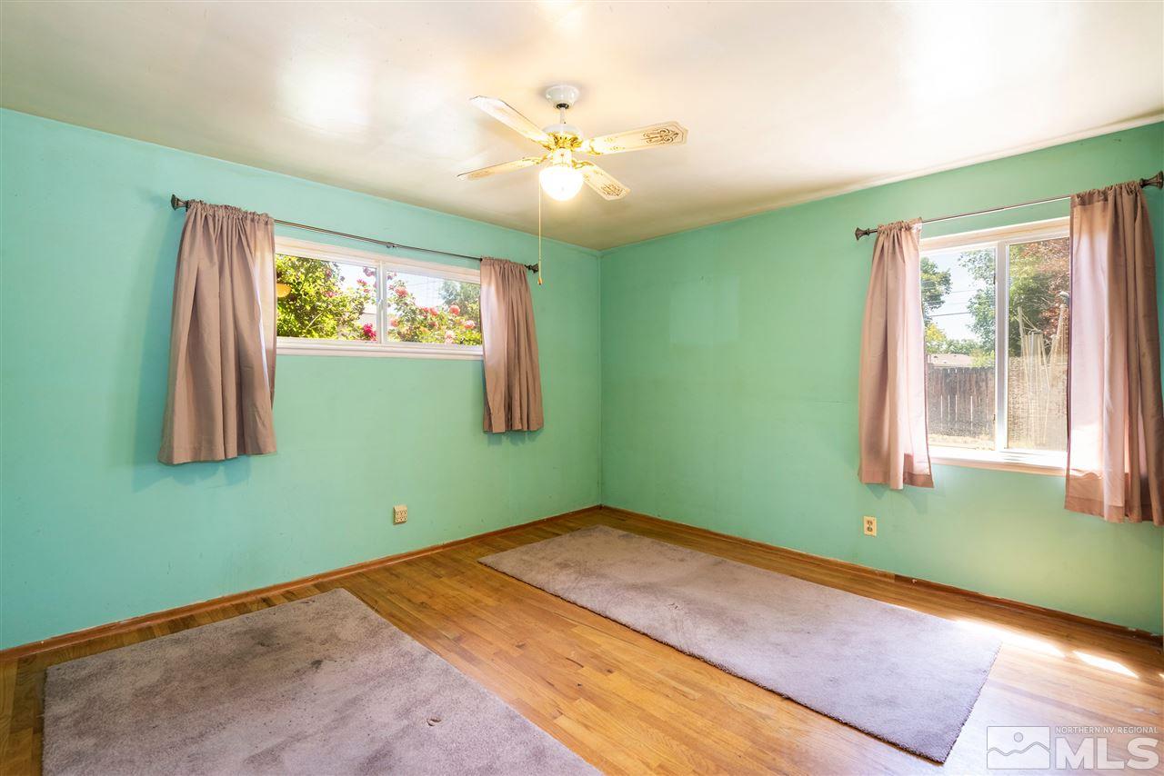 1555 Auburn Way Reno, NV 89502 - Photo 9 of 14 a room with window and ceiling fan