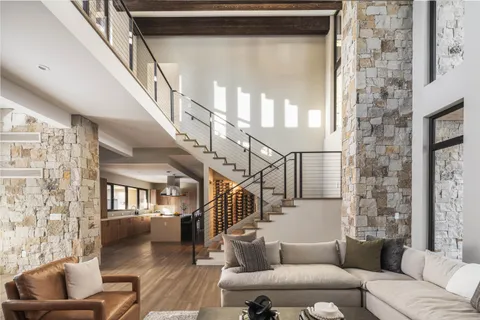 a living room with furniture windows and a fireplace