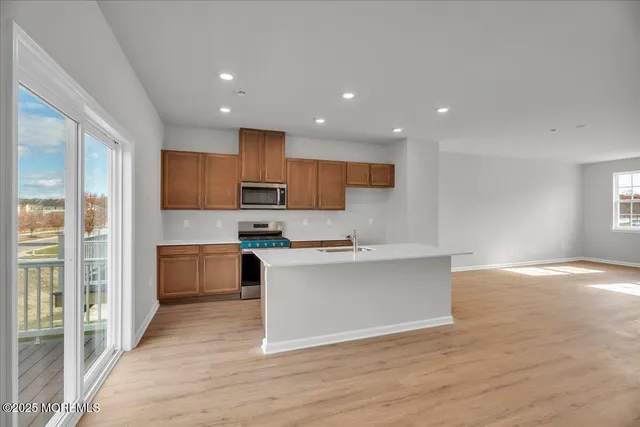a view of kitchen with cabinets and wooden floor