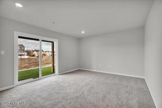 a view of an empty room with a sliding door