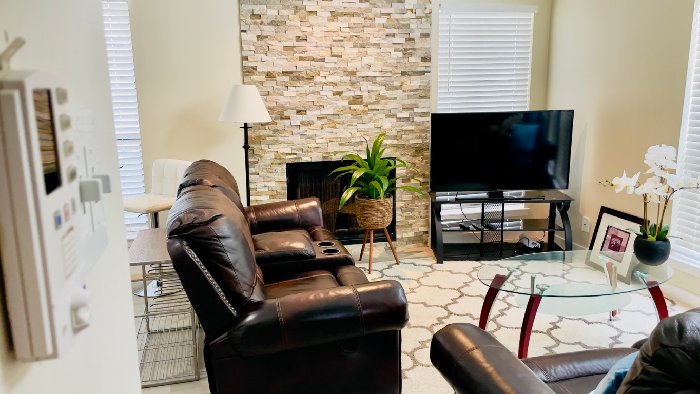 2902 Cole Street, Unit 311 Austin, TX 78705 - Photo 2 of 16 Living area with a fireplace