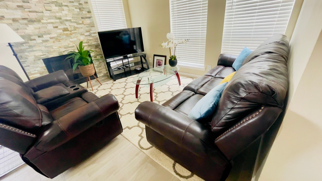 2902 Cole Street, Unit 311 Austin, TX 78705 - Photo 6 of 16 Living area with wood finished floors and plenty of natural light