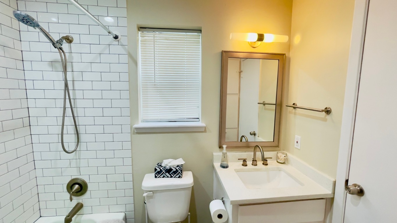 2902 Cole Street, Unit 311 Austin, TX 78705 - Photo 9 of 16 Bathroom with shower / tub combination and vanity