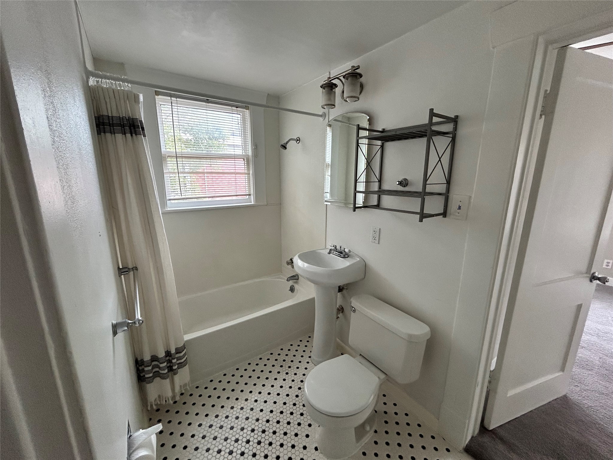 1639 Norfolk Street, Unit 2 Houston, TX 77006 - Photo 13 of 17 a bathroom with a sink toilet and shower