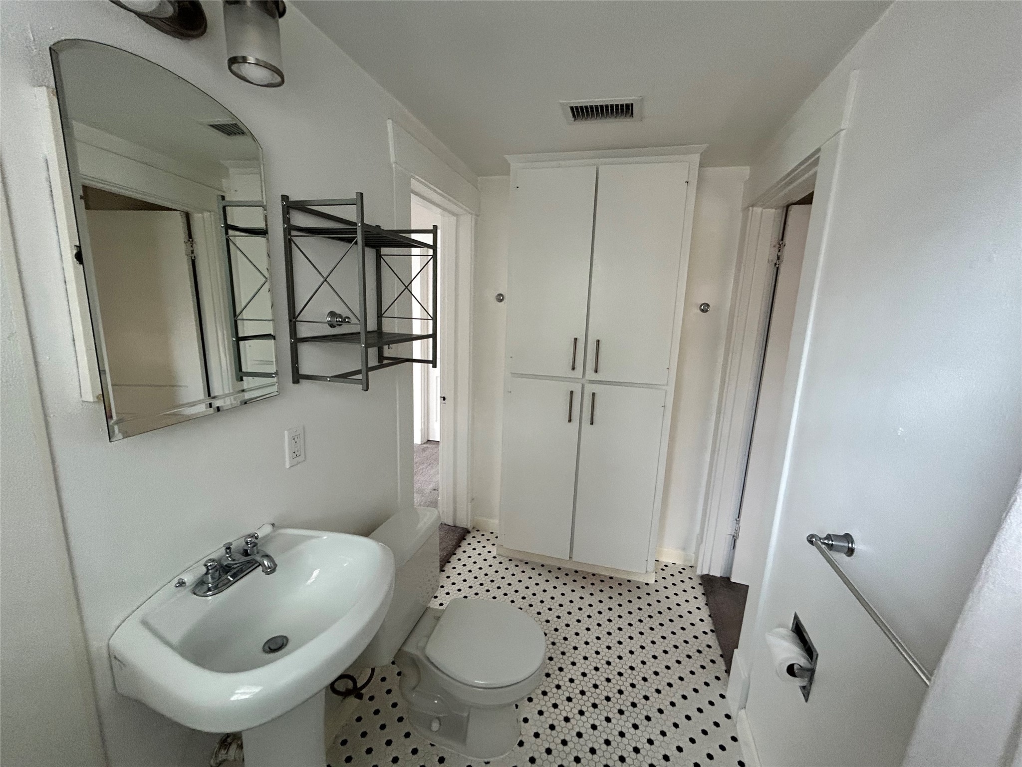 1639 Norfolk Street, Unit 2 Houston, TX 77006 - Photo 14 of 17 a bathroom with a sink and a mirror