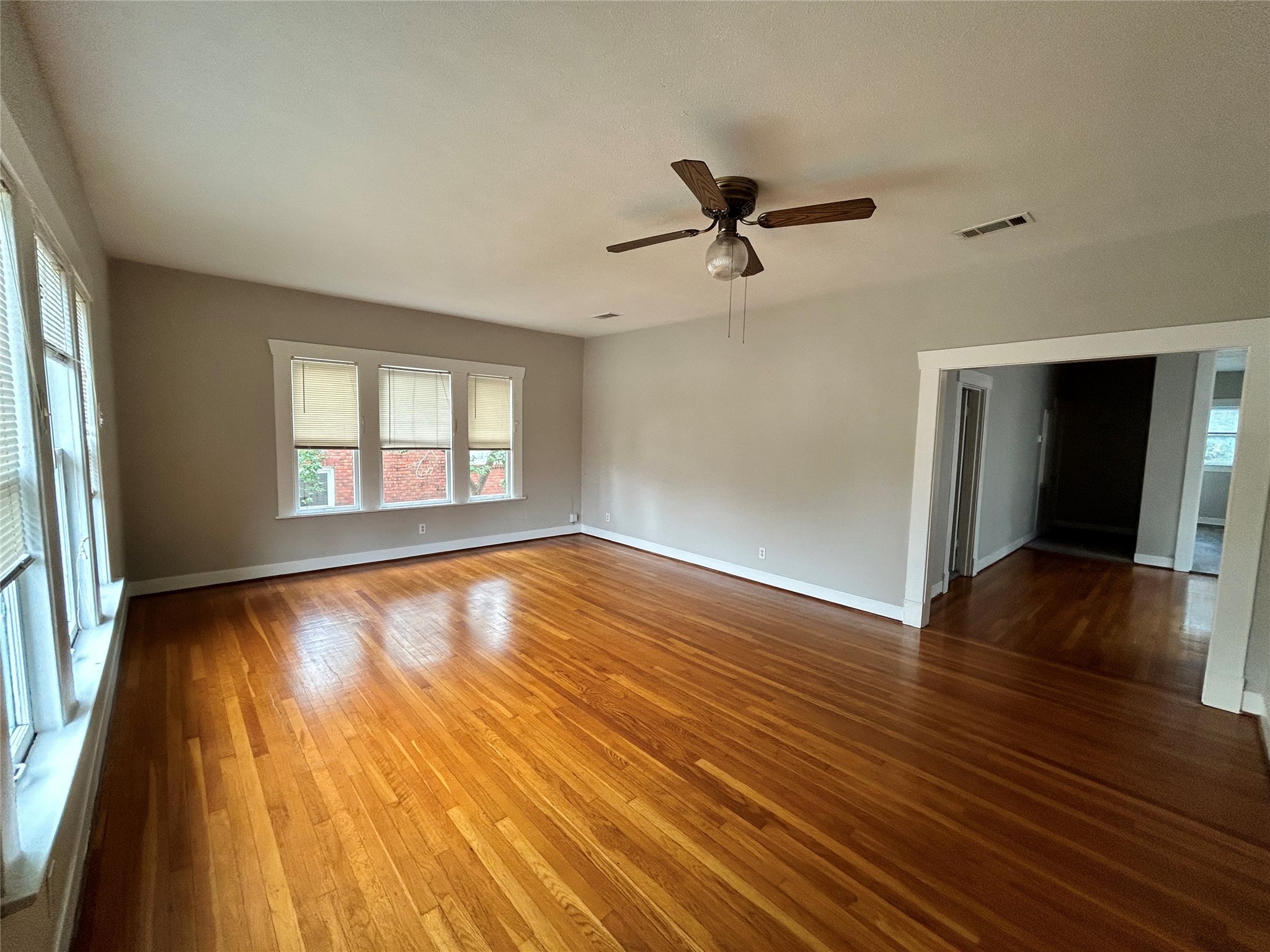 1639 Norfolk Street, Unit 2 Houston, TX 77006 - Photo 2 of 17 a view of empty room with wooden floor and fan