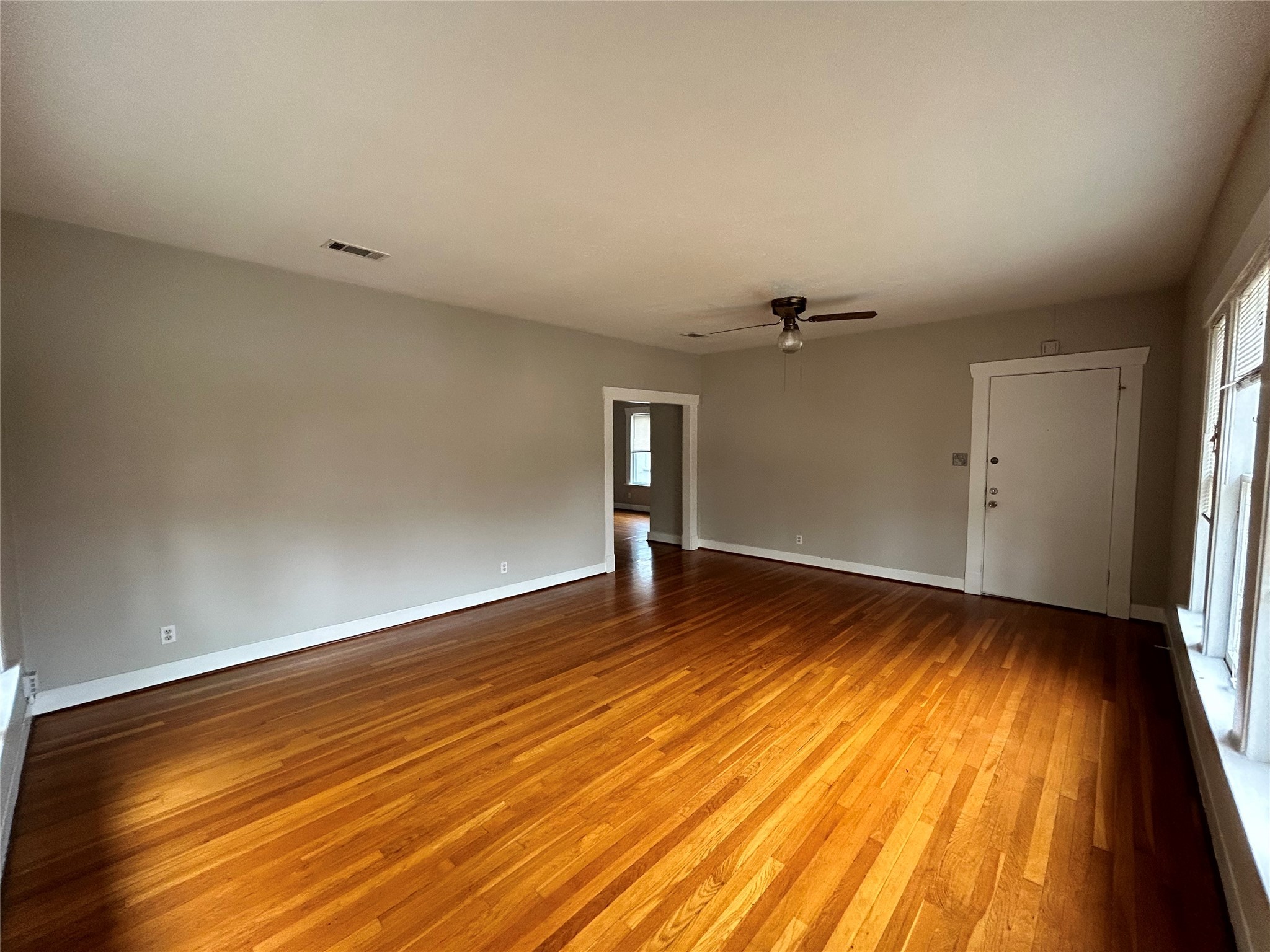1639 Norfolk Street, Unit 2 Houston, TX 77006 - Photo 3 of 17 wooden floor in an empty room