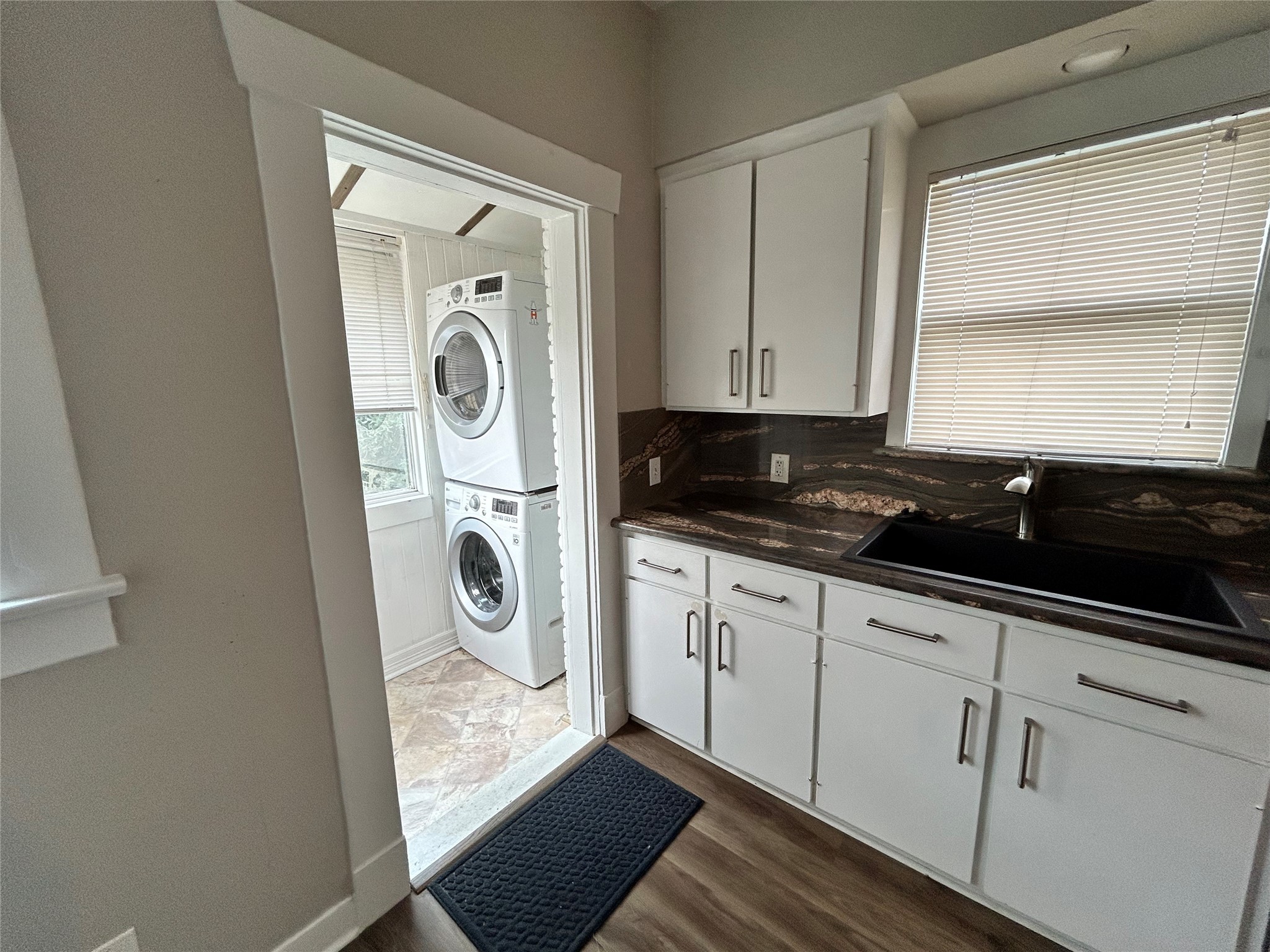 1639 Norfolk Street, Unit 2 Houston, TX 77006 - Photo 10 of 17 a utility room with sink dryer and washer