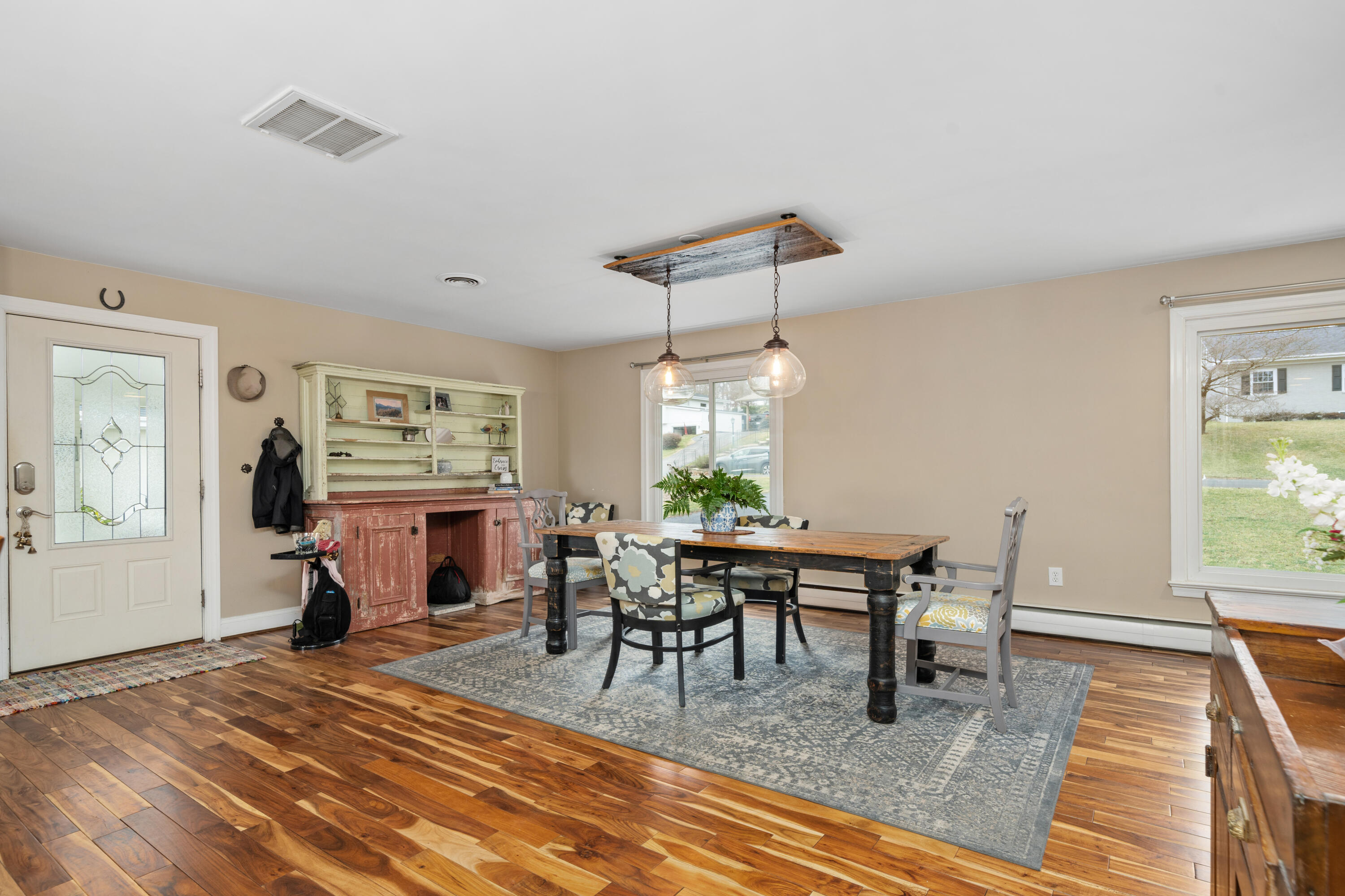 1719 Blair Road Southwest Roanoke, VA 24015 - Photo 15 of 40 a dining room with furniture a rug and a chandelier