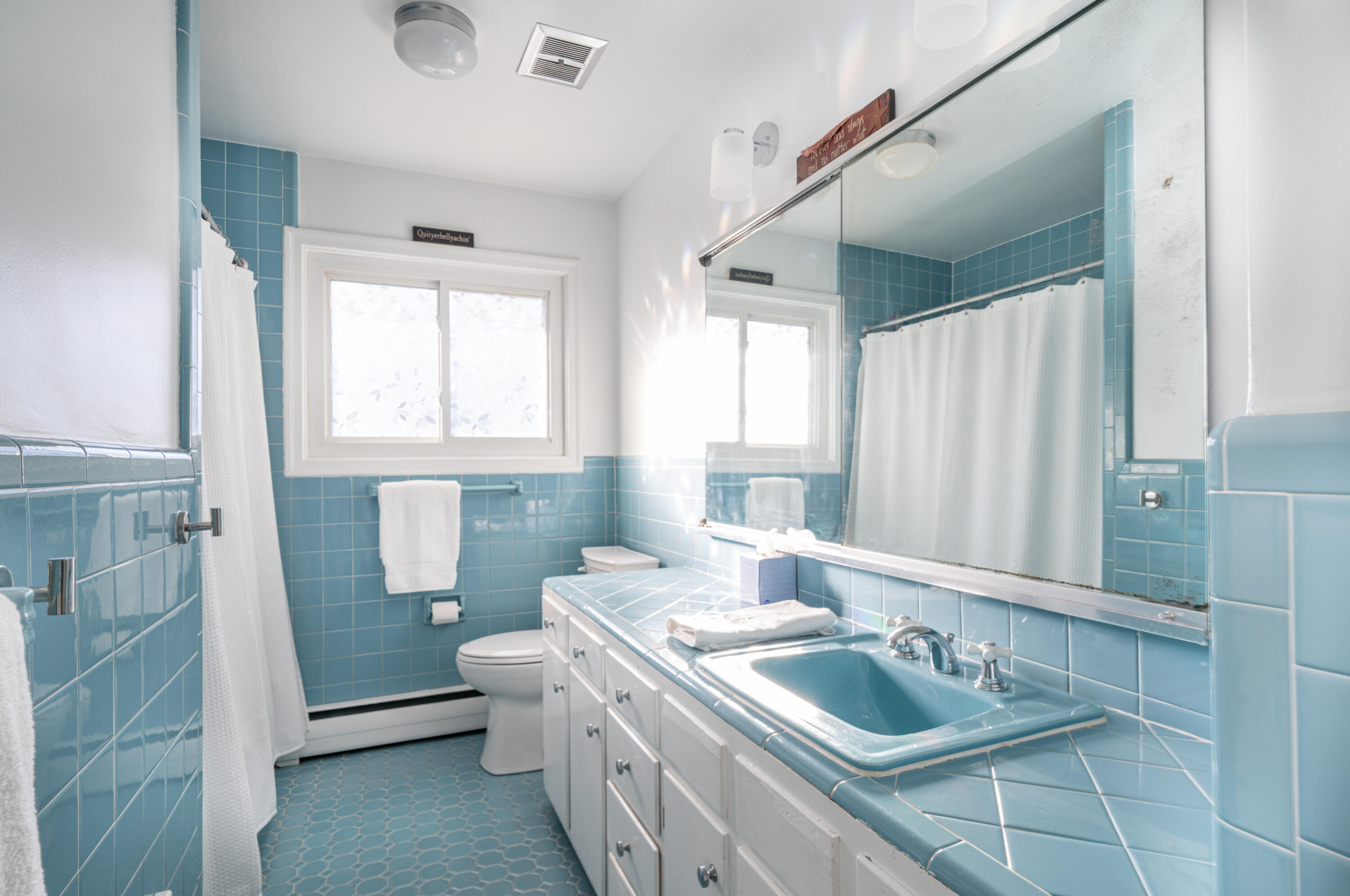 1719 Blair Road Southwest Roanoke, VA 24015 - Photo 23 of 40 a bathroom with a granite countertop sink mirror vanity and toilet