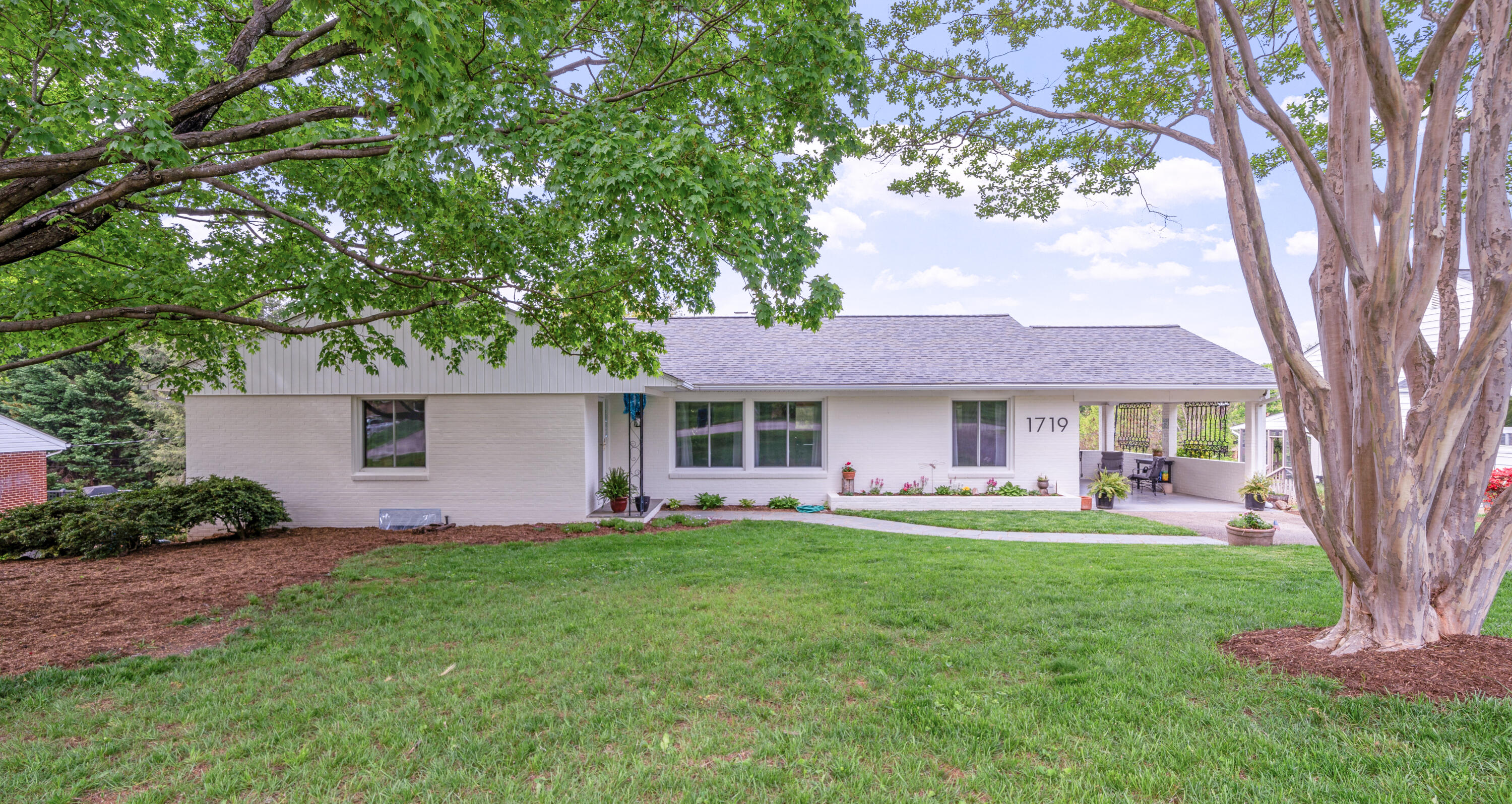 1719 Blair Road Southwest Roanoke, VA 24015 - Photo 24 of 40 a front view of a house with a yard and trees