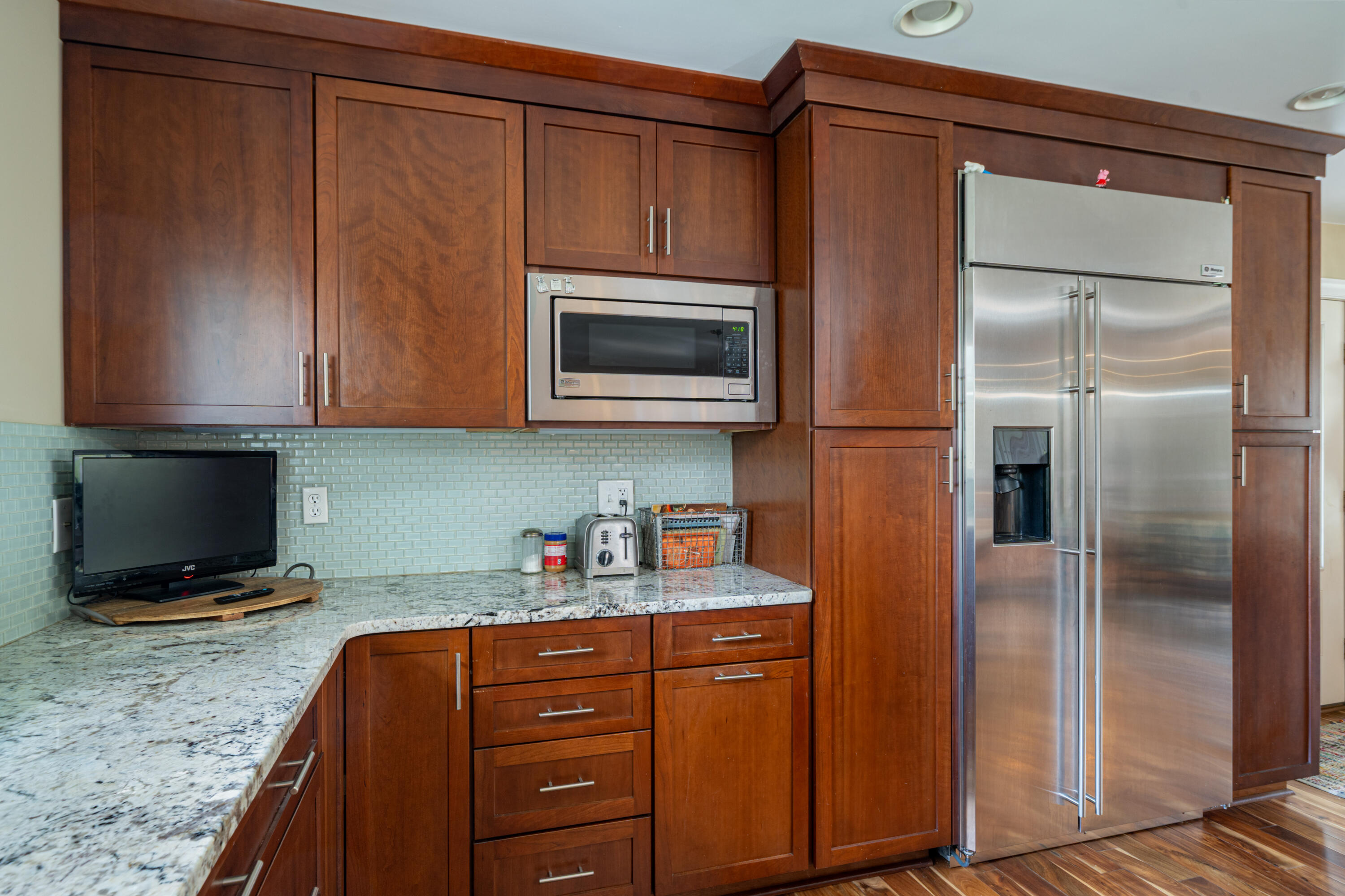 1719 Blair Road Southwest Roanoke, VA 24015 - Photo 8 of 40 a kitchen with stainless steel appliances granite countertop a refrigerator microwave and sink
