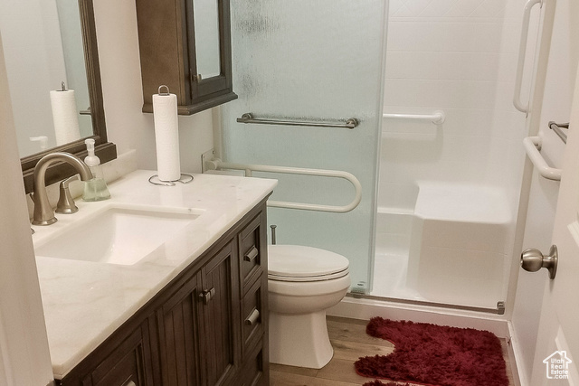 2855 South 1000 West Perry, UT 84302 - Photo 45 of 142 Bathroom with a stall shower, vanity, and wood finished floors