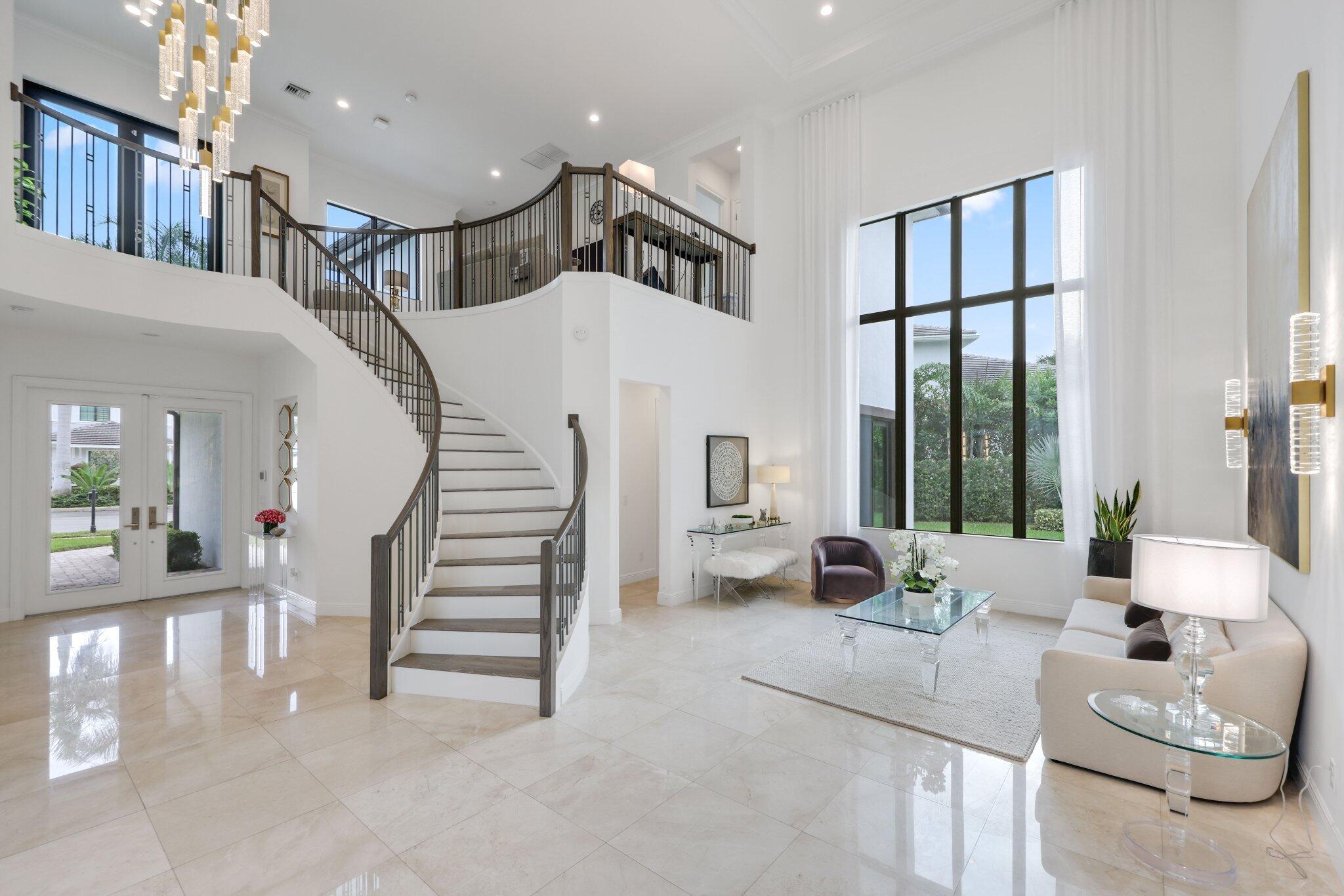2751 Northwest 70th Boulevard Boca Raton, FL 33496 - Photo 12 of 76 a living room with furniture and a large window