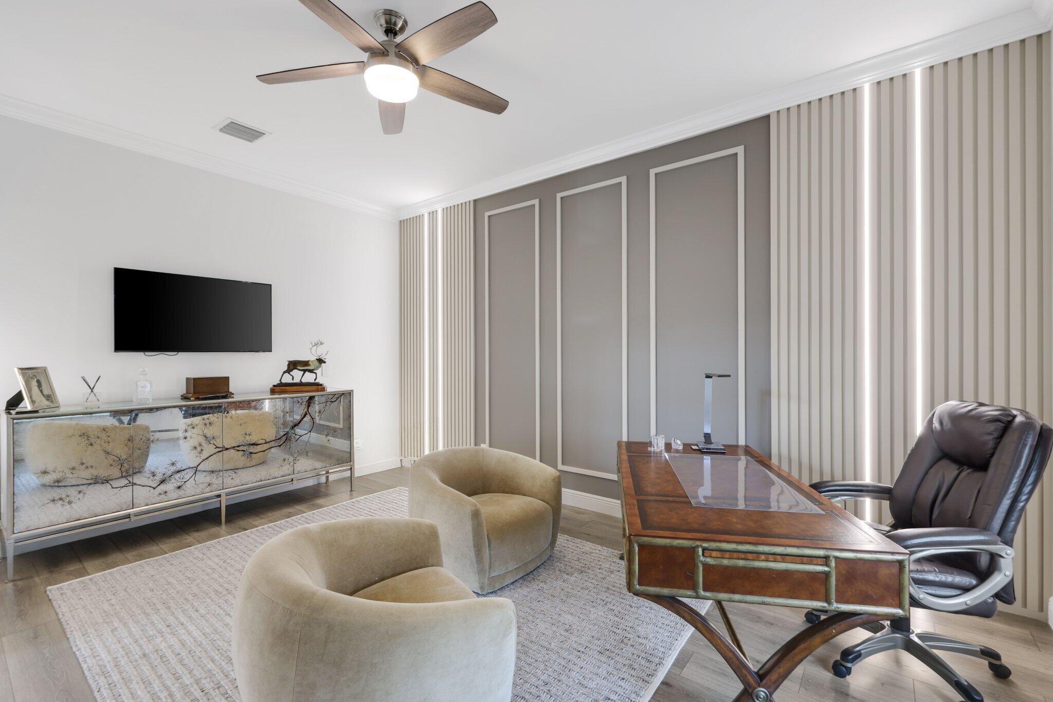 2751 Northwest 70th Boulevard Boca Raton, FL 33496 - Photo 15 of 76 a living room with furniture and a flat screen tv