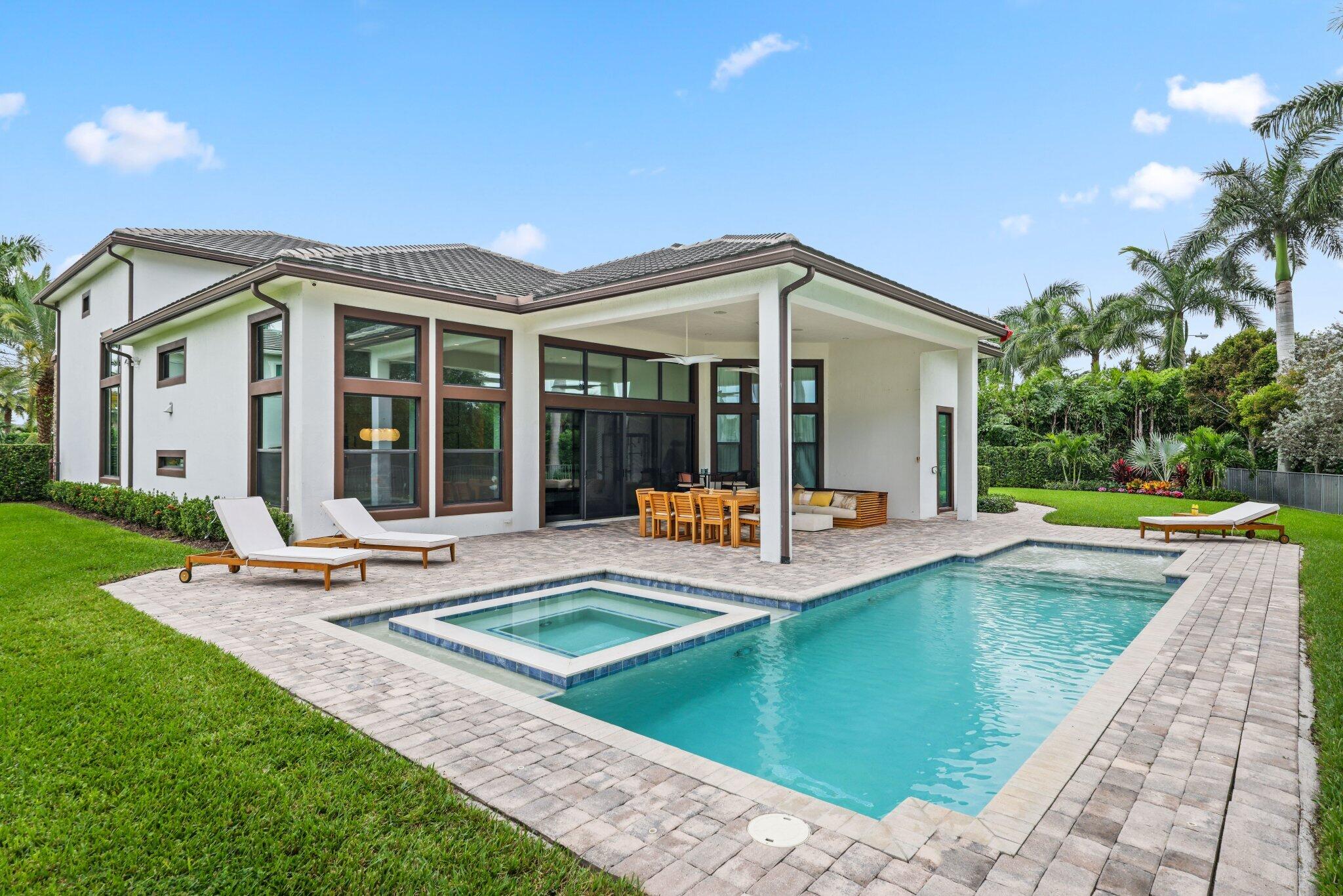 2751 Northwest 70th Boulevard Boca Raton, FL 33496 - Photo 27 of 76 a view of a house with swimming pool and sitting area