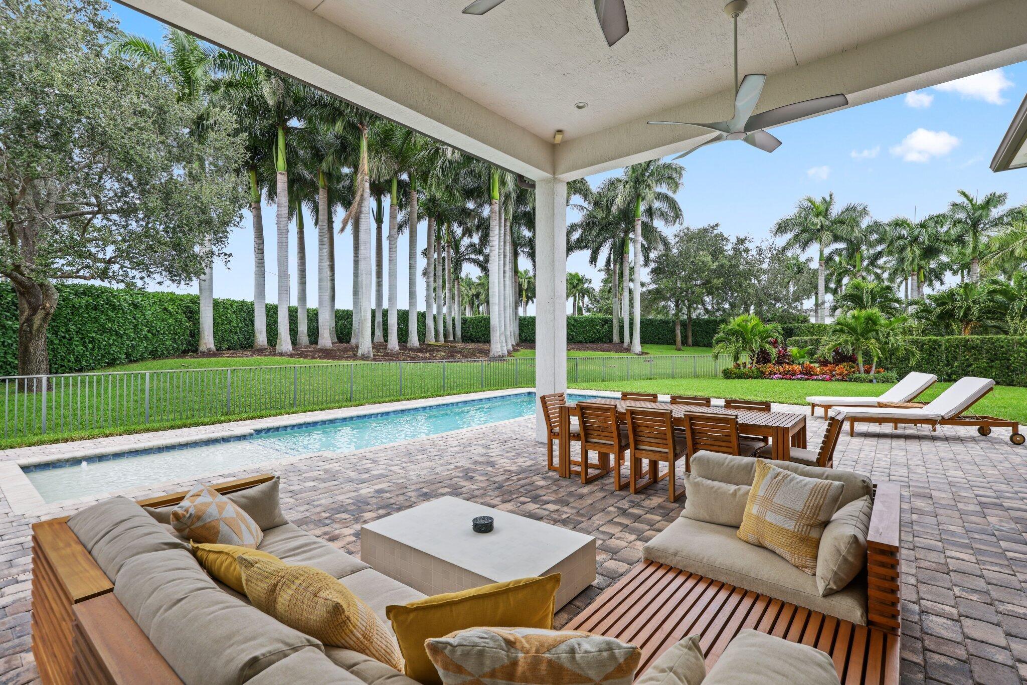 2751 Northwest 70th Boulevard Boca Raton, FL 33496 - Photo 30 of 76 a view of a patio with couches and table