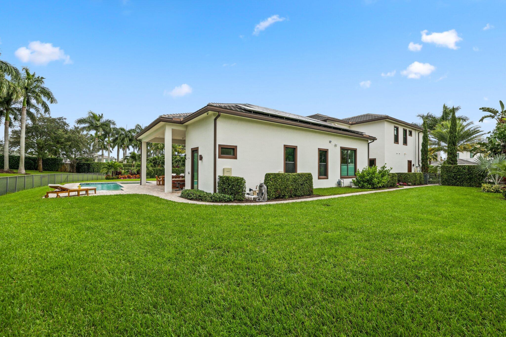 2751 Northwest 70th Boulevard Boca Raton, FL 33496 - Photo 36 of 76 a view of a house with a yard