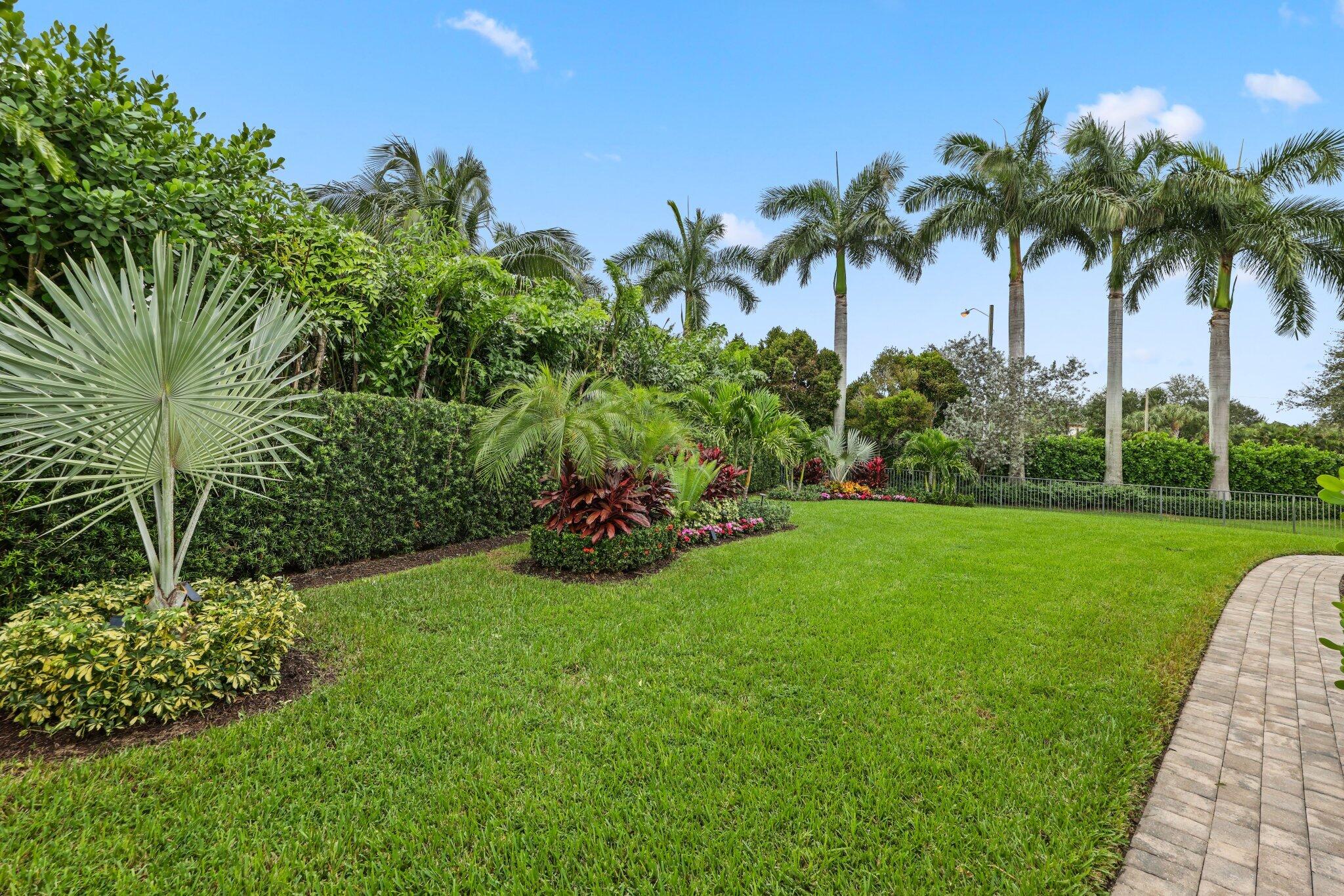 2751 Northwest 70th Boulevard Boca Raton, FL 33496 - Photo 37 of 76 a view of a garden with a tree