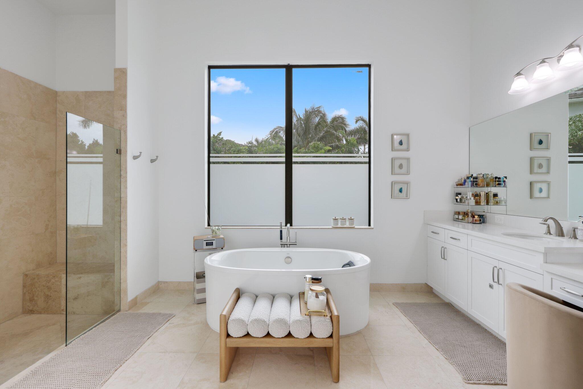 2751 Northwest 70th Boulevard Boca Raton, FL 33496 - Photo 39 of 76 a bathroom with a sink and a bathtub