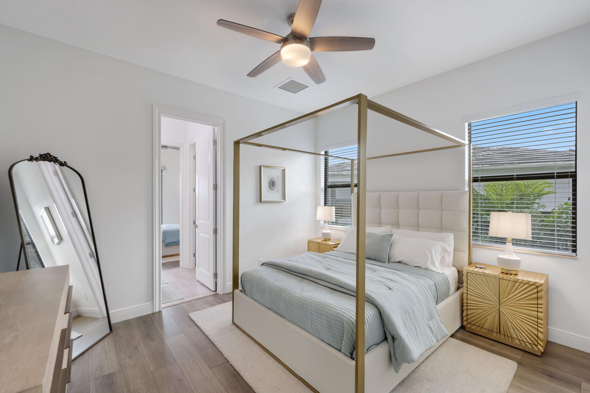 2751 Northwest 70th Boulevard Boca Raton, FL 33496 - Photo 51 of 76 a bedroom with a bed couch and a window