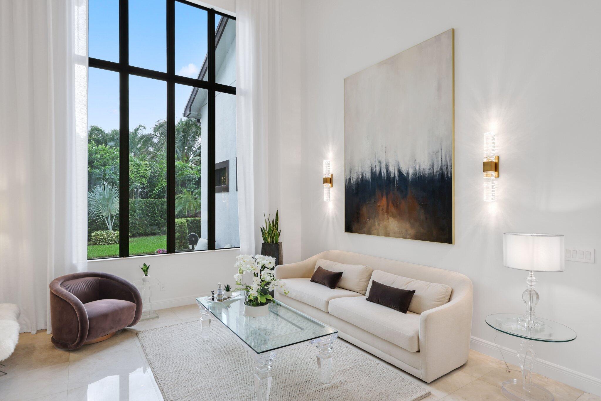 2751 Northwest 70th Boulevard Boca Raton, FL 33496 - Photo 9 of 76 a living room with furniture and a large window