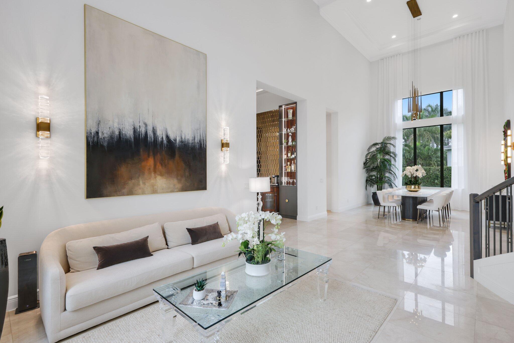 2751 Northwest 70th Boulevard Boca Raton, FL 33496 - Photo 10 of 76 a living room with furniture and a large window